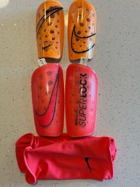 Nike Mercurial Superlock Shin Guards in Orange and Red